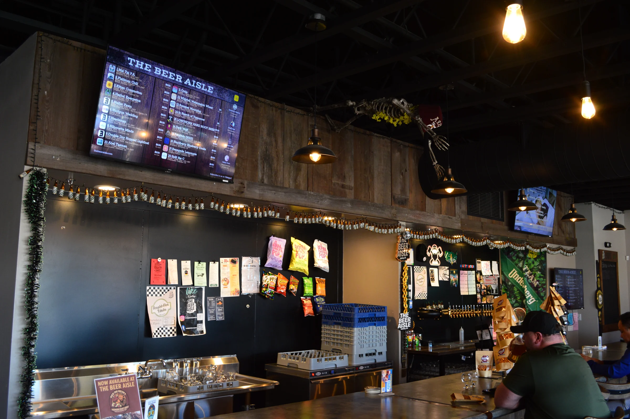 Warm lights and a welcoming bar at The Beer Aisle
