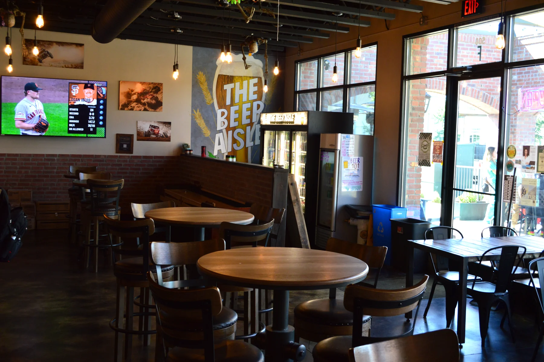 Wood tables, warm lighting, and room for friends in the tap room